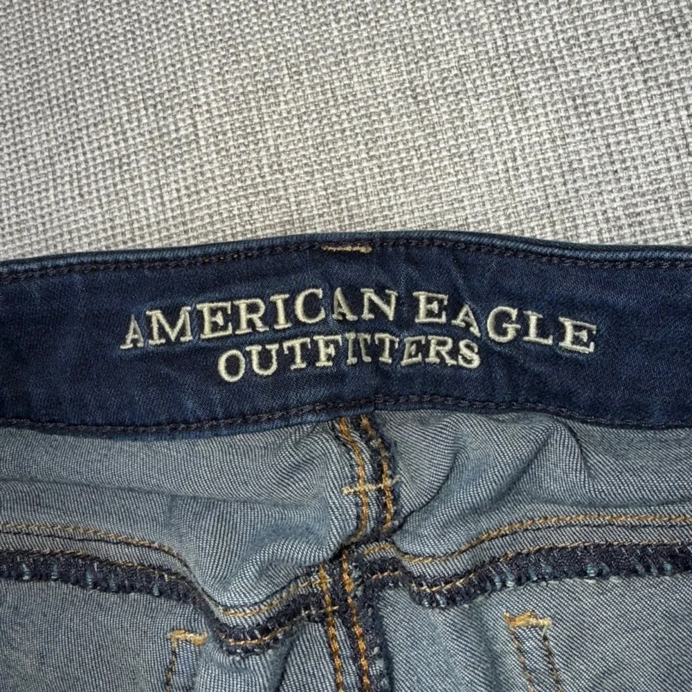 American Eagle Super Stretch Jeggings Dark Wash Distressed Ripped Knee Size 0